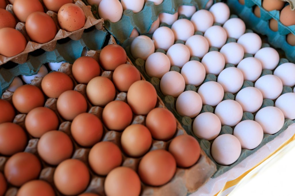 pexels-photo-30893350-30893350 Close-up of brown and white eggs arranged in cartons, showcasing variety.